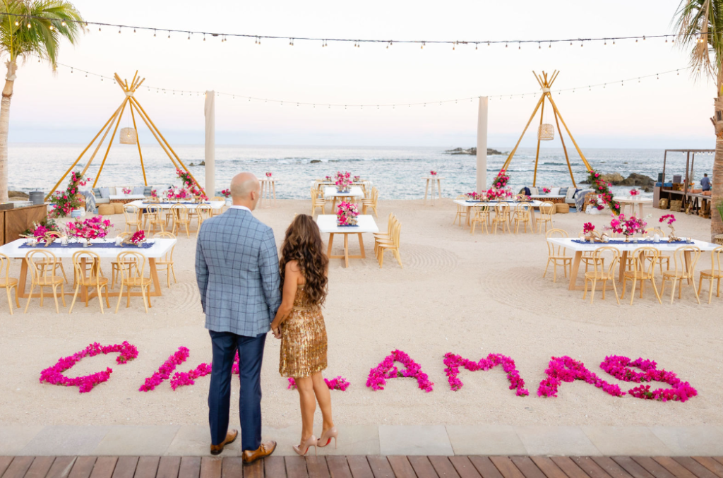 A romantic beachside destination wedding with stunning floral arrangements and the ocean backdrop.