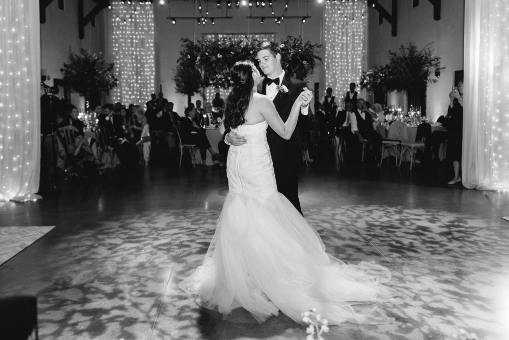 The bride and groom dancing together