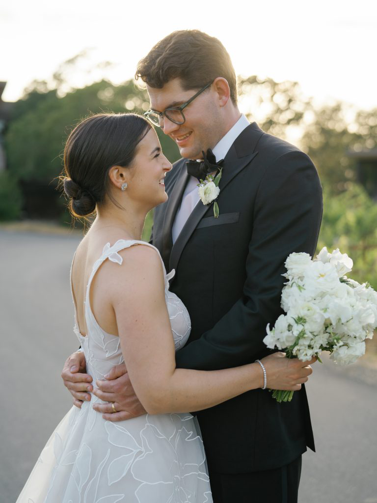 A joyful couple embraces on their Chicago wedding day, showcasing timeless love and elegant style