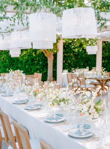 Luxuriously set wedding tables with elegant floral arrangements, and ambient lighting for a sophisticated celebration