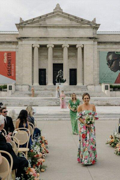 Bridesmaids walking down the aisle at a wedding