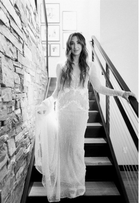 a bride standing on the staircase.