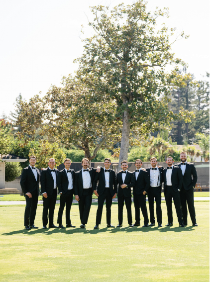 An image of a groom with his wedding party 