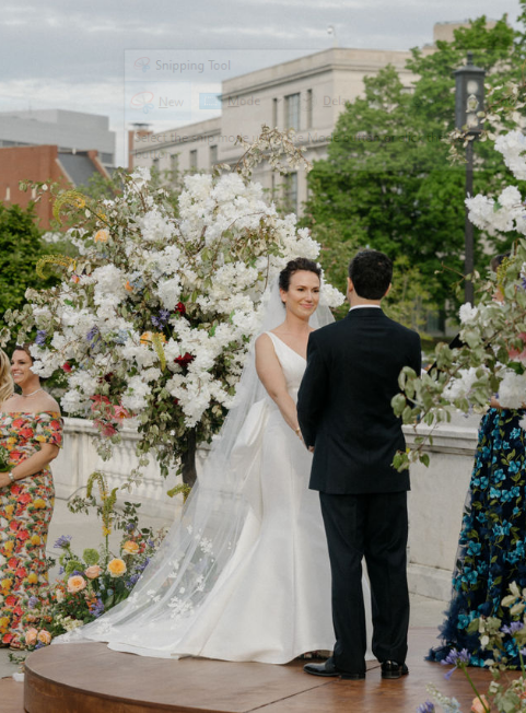 A couple facing each other at the altar during a wedding ceremony.