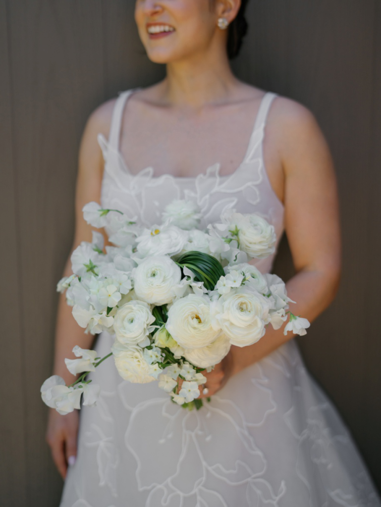 a bride holding a bouquet.