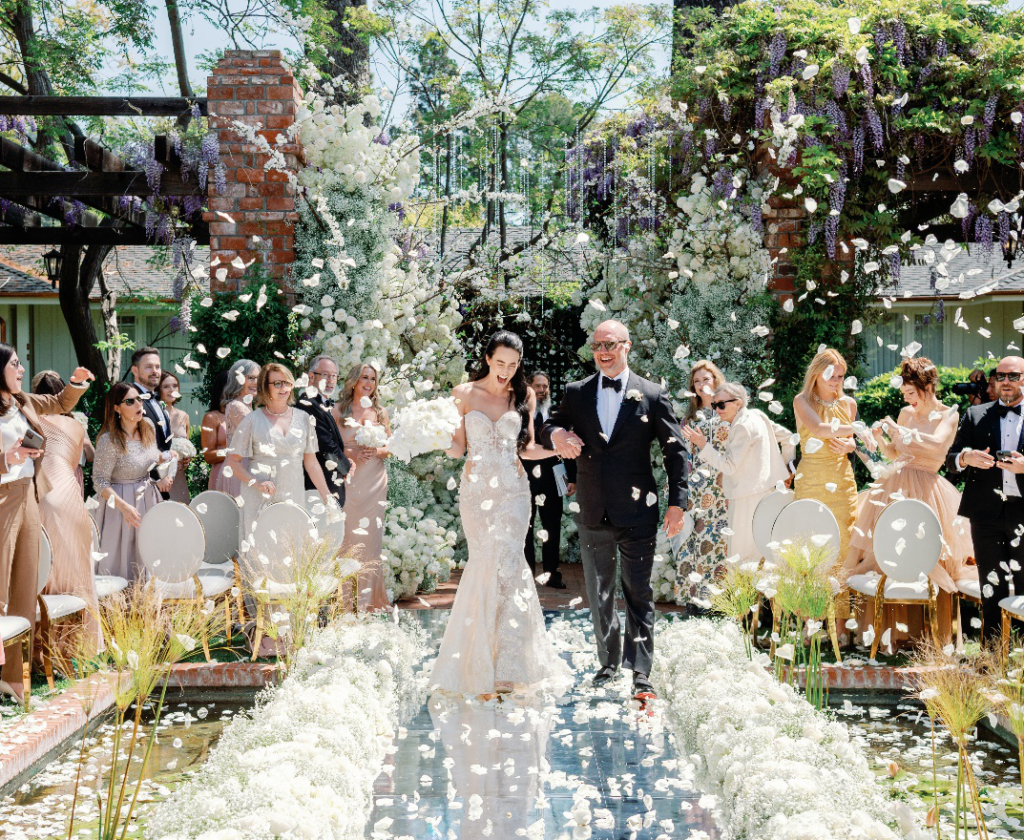 A bride and groom walking down the aisle at their Santa Barbara wedding.