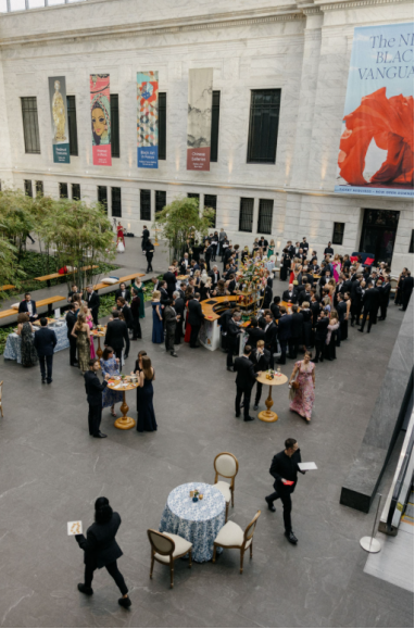 Guests mingling during a sophisticated indoor wedding reception at a Washington, DC venue with artistic decor.