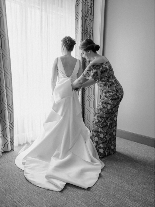 a bride getting into her dress.