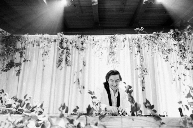 a DJ playing music at a wedding party.