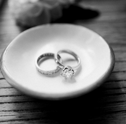 a diamond engagement ring in a trinket tray