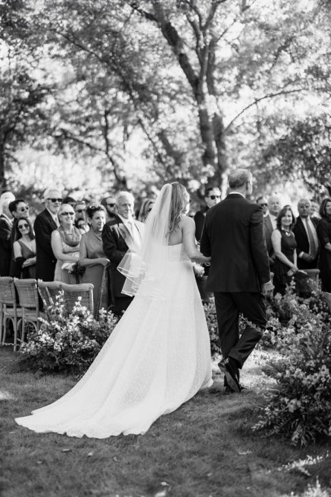 a bride walking down the aisle at her wedding