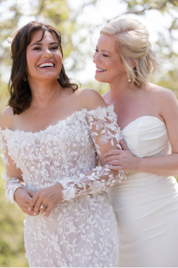 a bride with brown hair in a white dress.