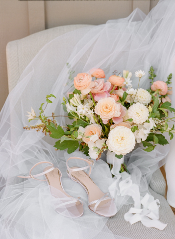 a beautiful wedding bouquet with peonies and roses.