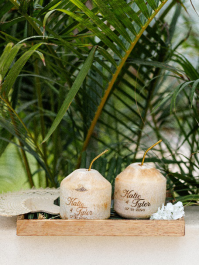 An image of coconuts on a wooden tray