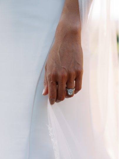 a diamond ring glittering on the bride’s finger