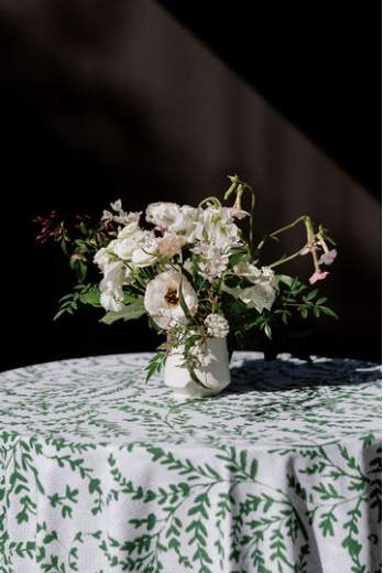 A white and ivory bouquet with coral accents