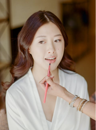 A bride getting her makeup done