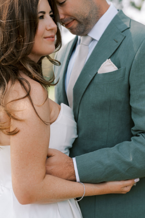 A groom perfectly complementing his bride