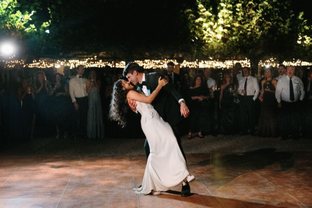 A couple gracefully finishes their first dance.