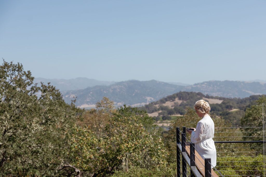 a bride looking at the mountain.
