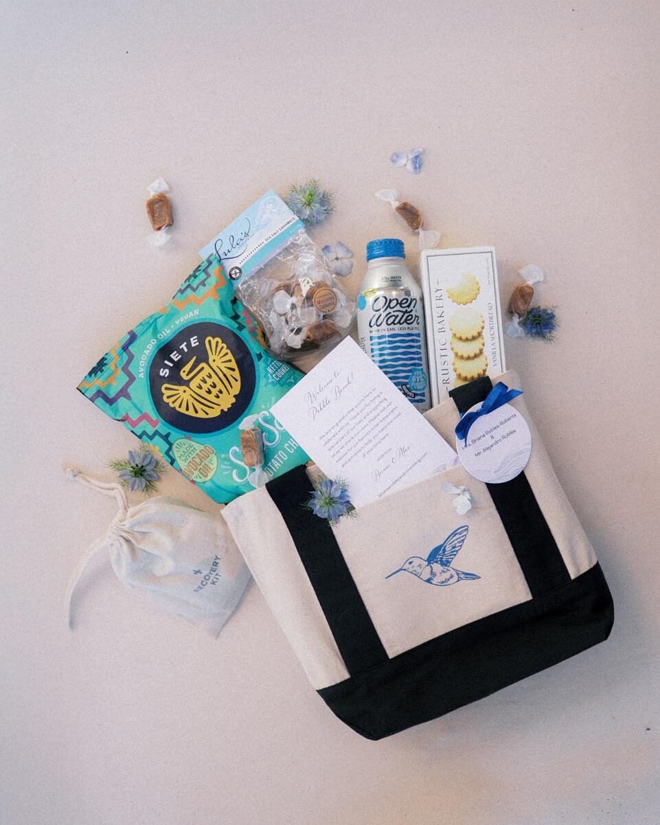 thoughtfully curated wedding welcome basket with assorted gifts arranged neatly