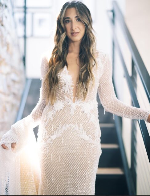 A bride wearing a dress with a modern silhouette.