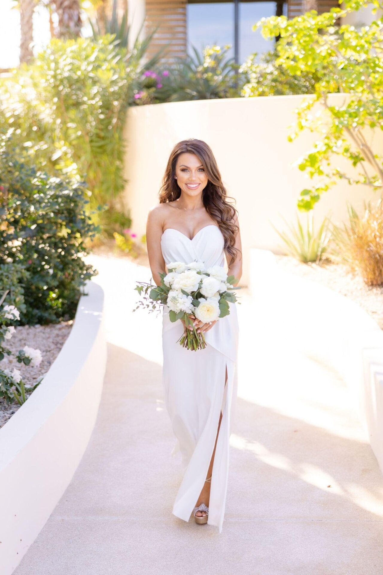 An image of a bride holding a bouquet of flowers