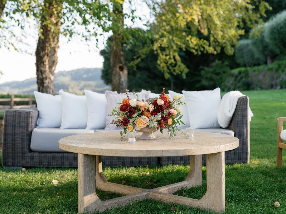 An image of flowers placed at the centre of a table