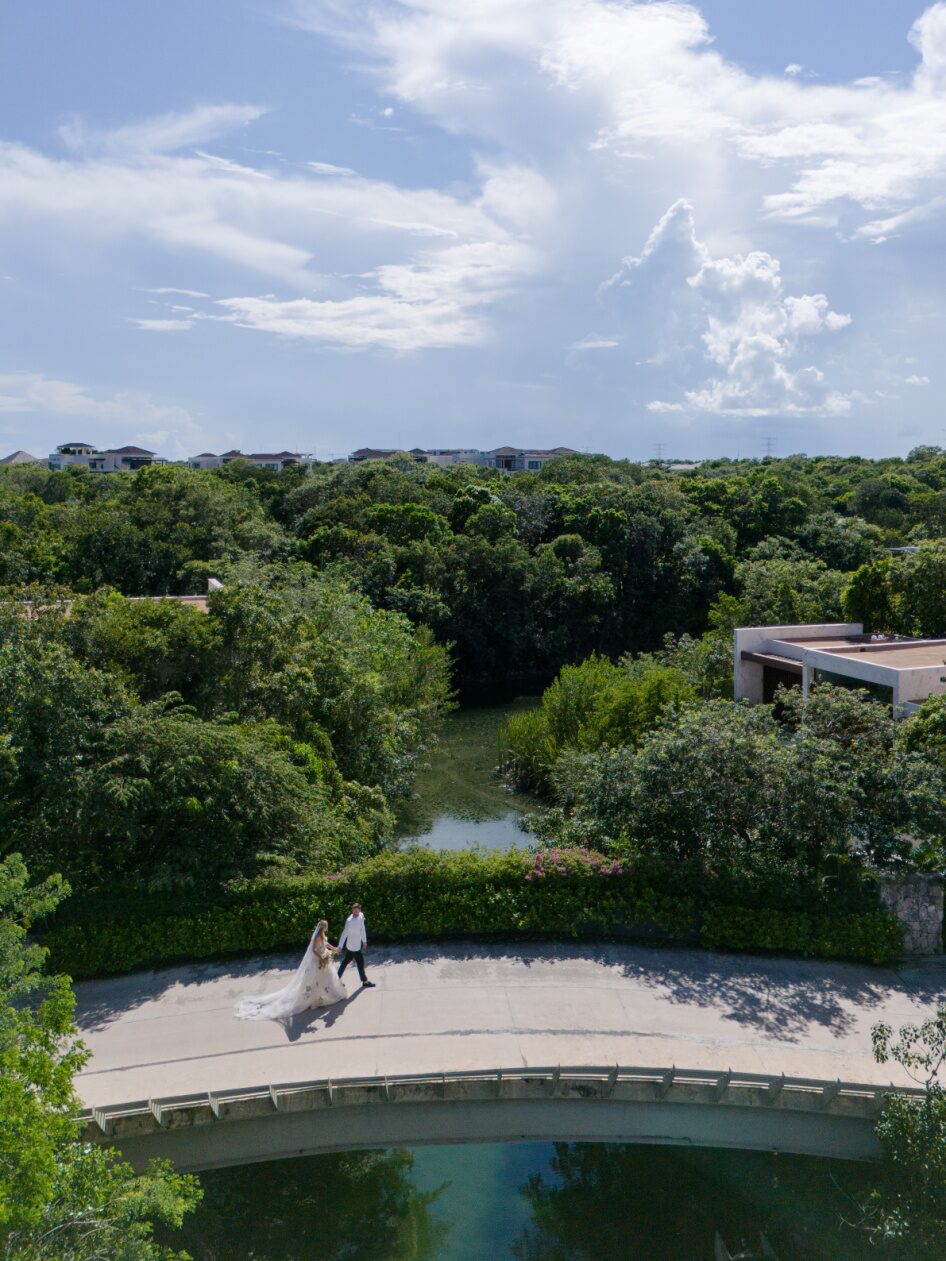 a bride and groom taking a walk.