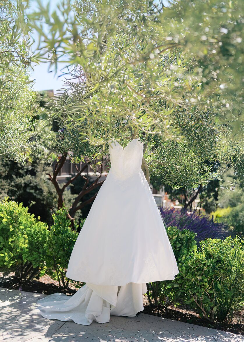 a bridal gown hanging outside.