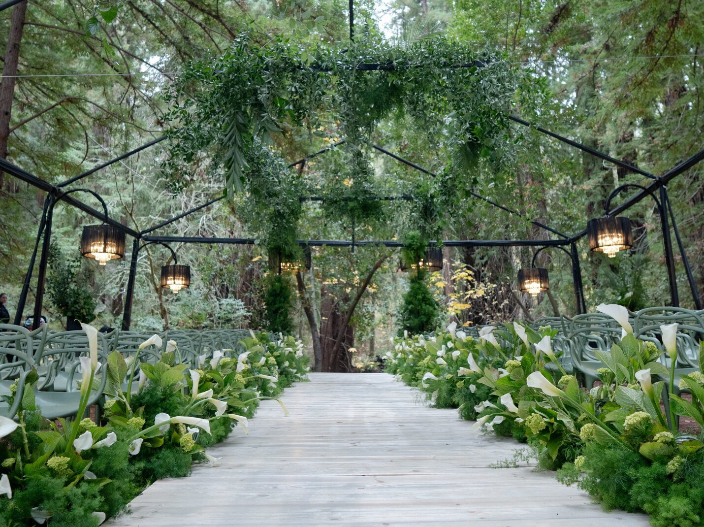 Beautiful outdoor wedding venue with tents and coverings designed to protect guests from rain.