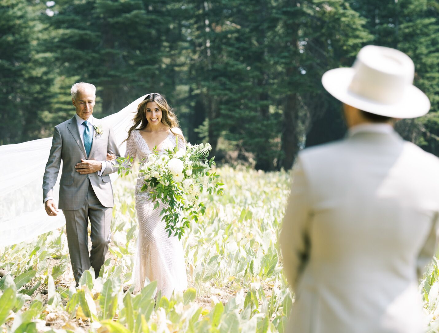 a bride walking with her father.
