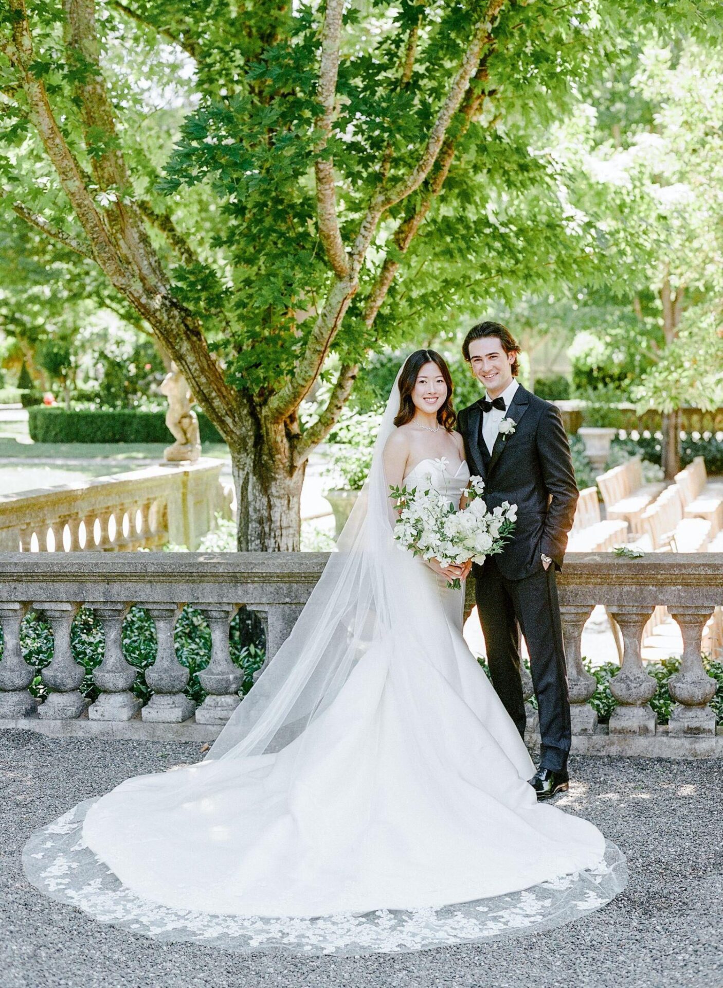 An image of a bride and a groom posing